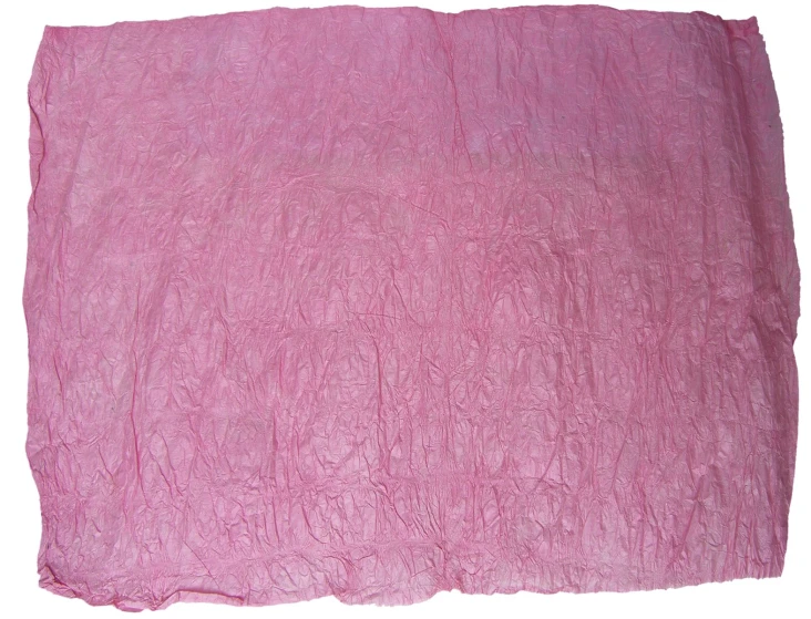 a pink cloth is laying on top of a white surface