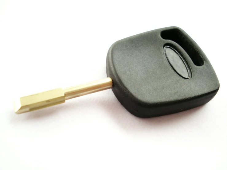 a remote key and car's car stick are on a white background