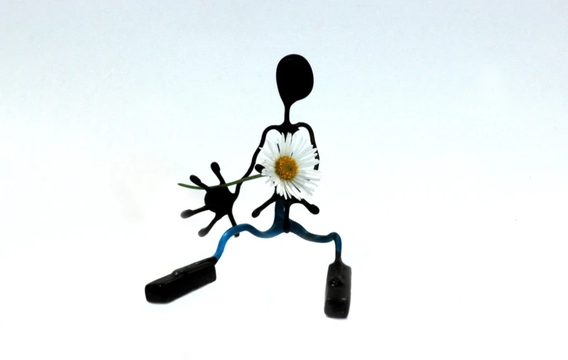 a black and white figure holding flowers and a knife