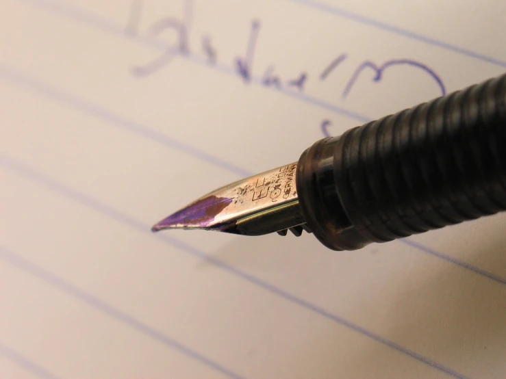 the fountain pen is being used to write