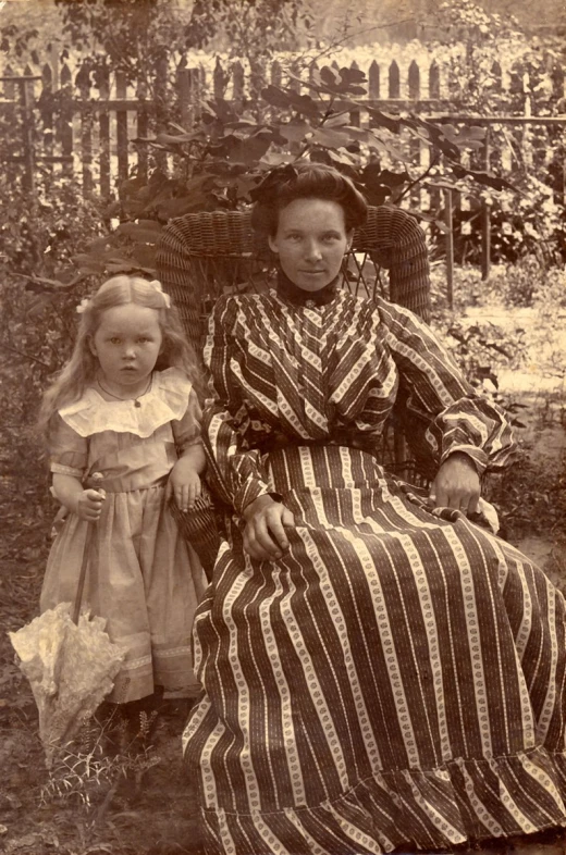 an old po of two little girls sitting next to each other