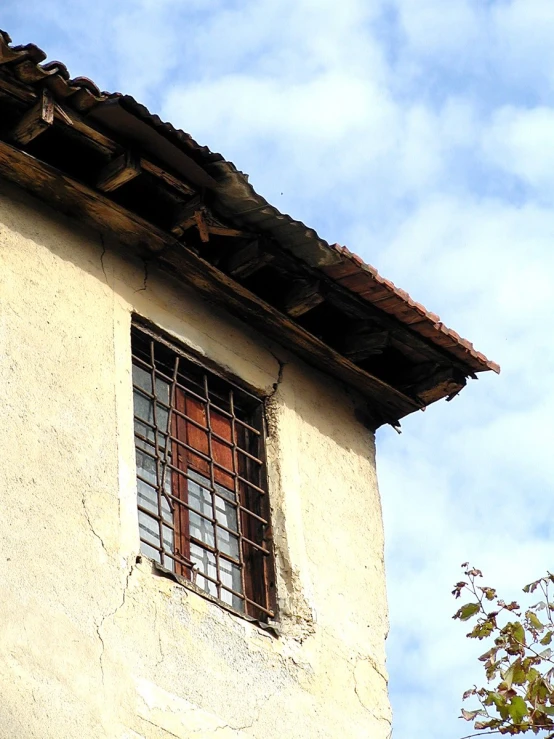 a picture of a tall building with two red windows