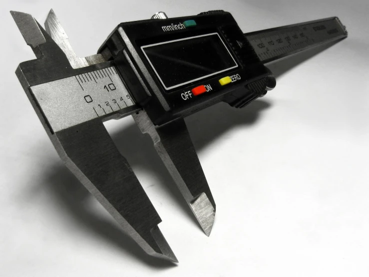 a black and white po of an electronic device with an adjustable gage