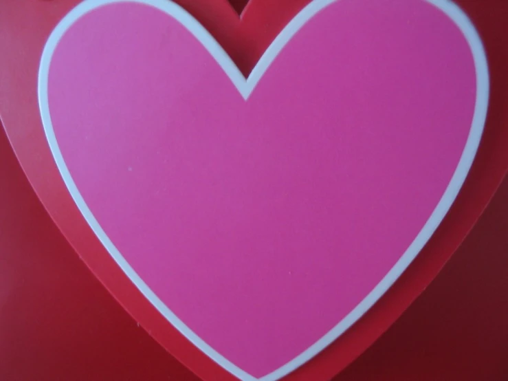 the pink heart has been cut into two smaller hearts