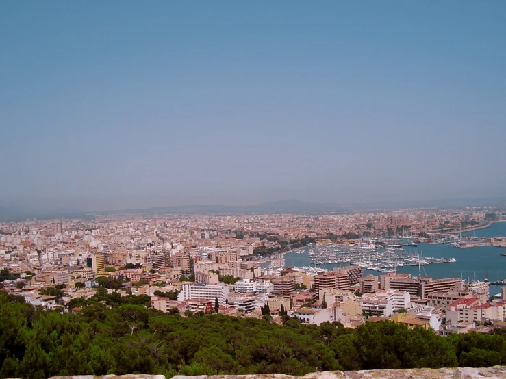 a po taken from above looking out at a harbor and large city in the background