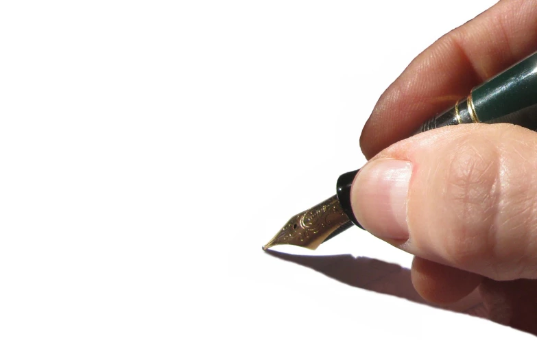 a person holding a pen with their thumb resting