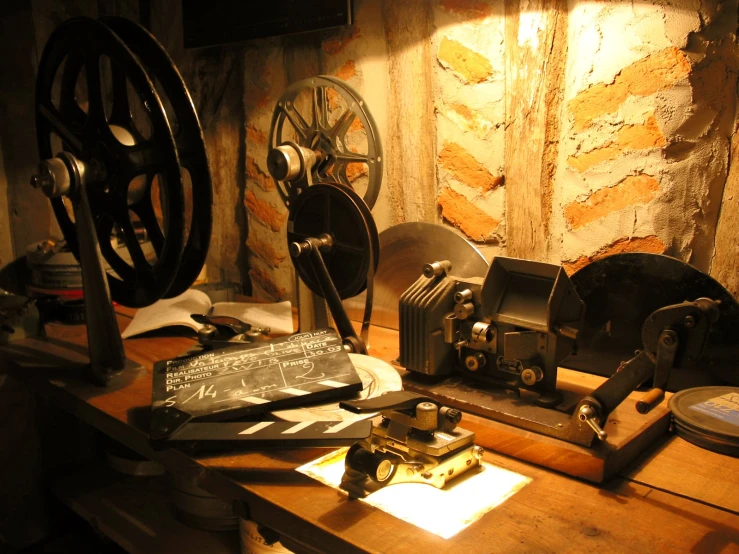 a group of old typewriters and other tools sitting on a wooden surface