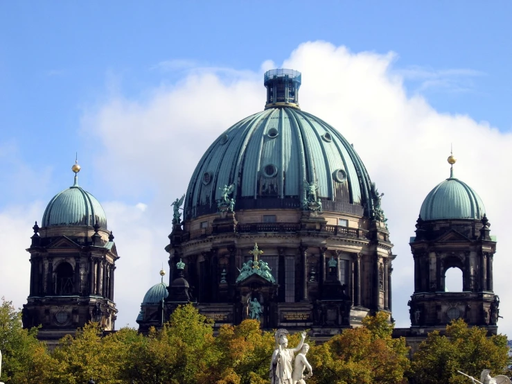 two buildings are shown against a blue sky