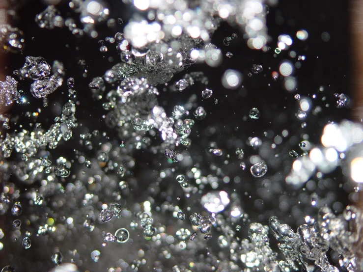 a close up s of the water droplets on a black background