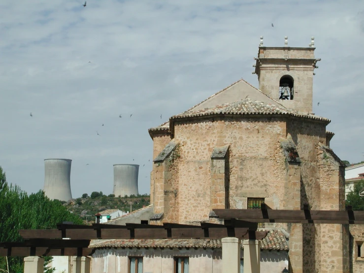 an old building has a small tower and a bell