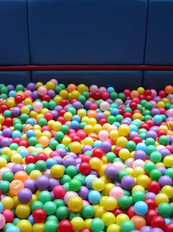 there is colorful balls on a blue table