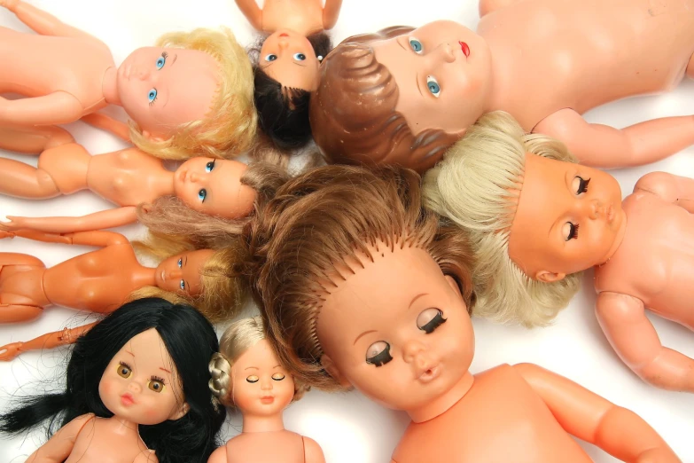 a group of dolls that have little children