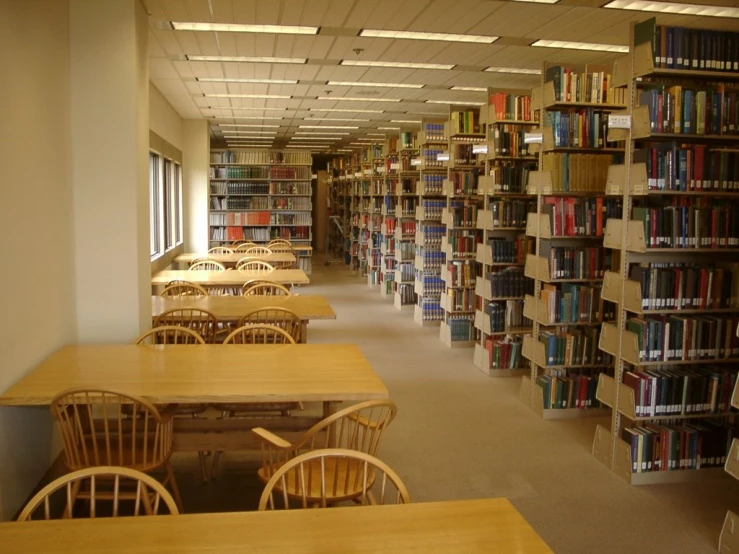 this is a liry full of books on a long shelf