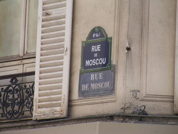 a sign on a building with french language lettering