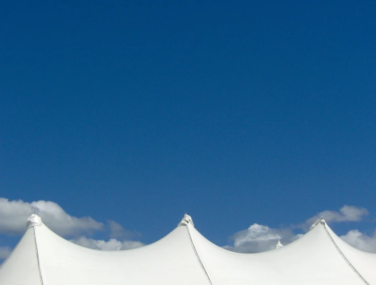 tents are set up against a clear blue sky