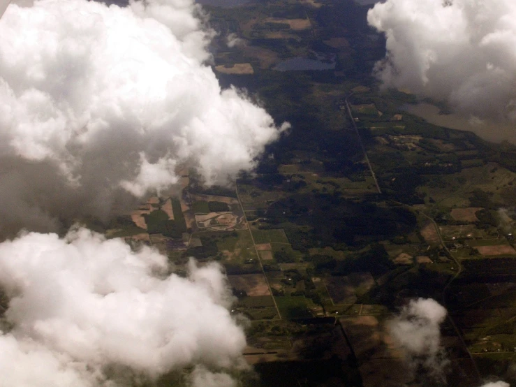 several clouds that are all flying in the sky