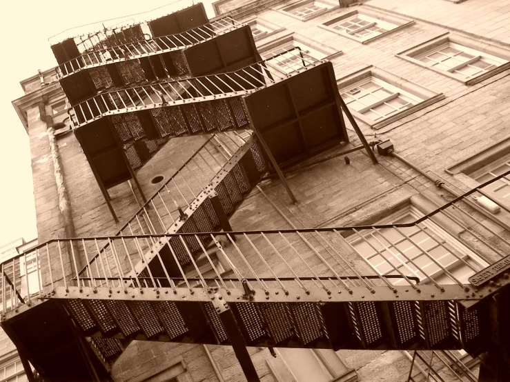 this is an old pograph of a building with the fire escape