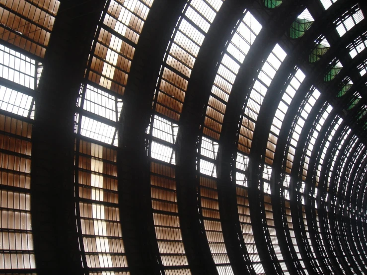 the interior of a train station with many wood slats