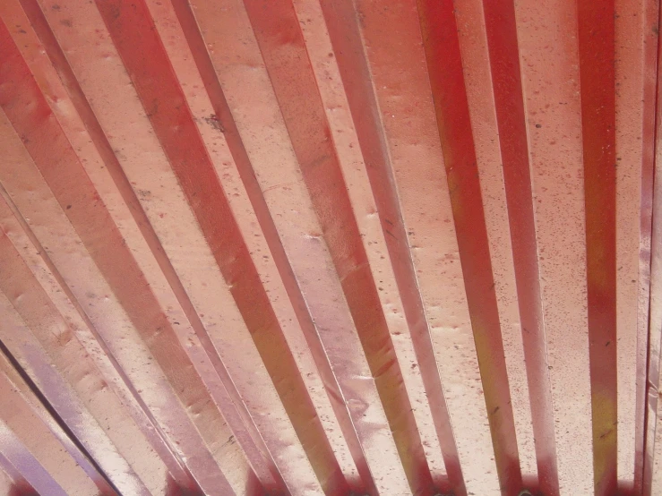 red and white lines on the ceiling, made to look like wood