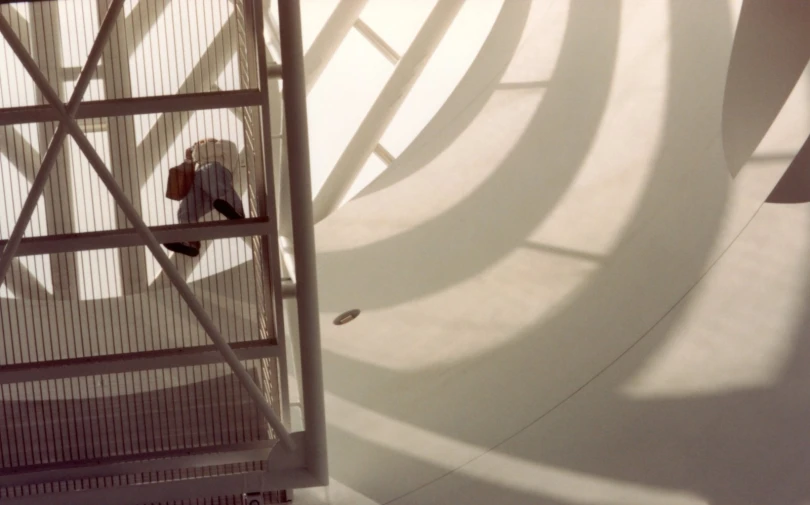 a man rides a skateboard up a ramp in a skate park