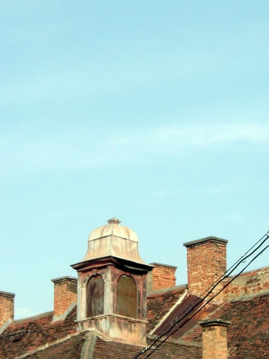 a bird that is sitting on a building