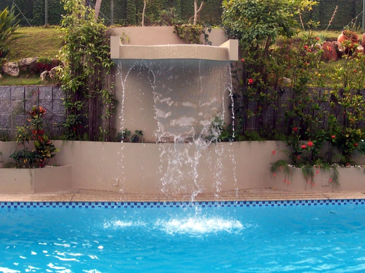 an above ground pool with water spraying from it
