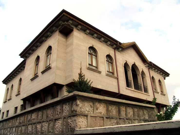 a big house with an interesting stone exterior