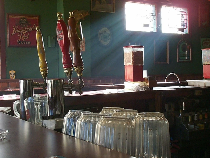 a room that has a bunch of glasses on the counter