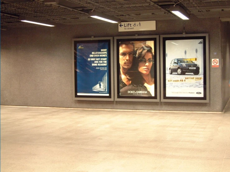 a bus stop with a lot of billboards