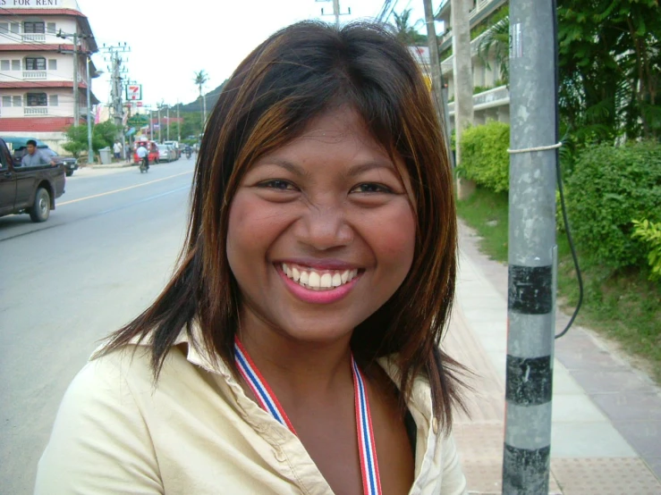 a pretty young lady smiling for the camera