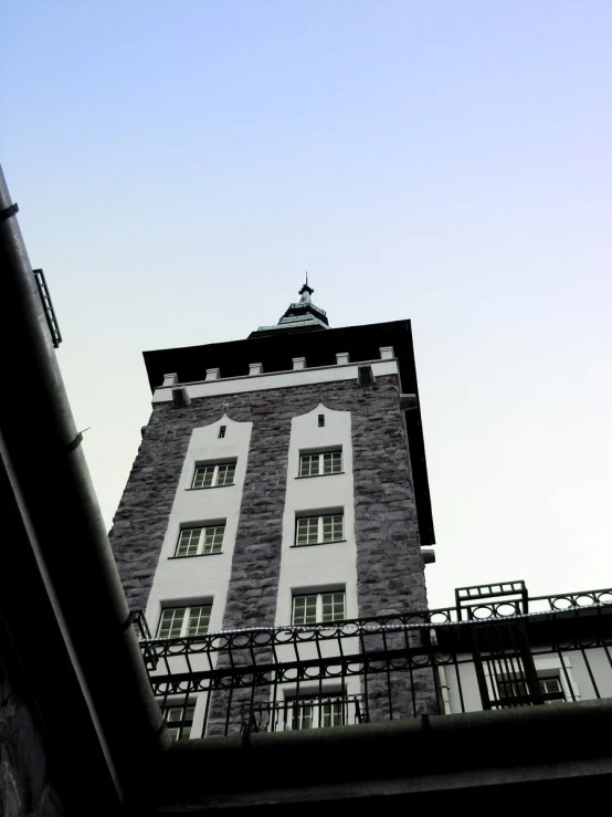 a view of a tall building near the top of a hill