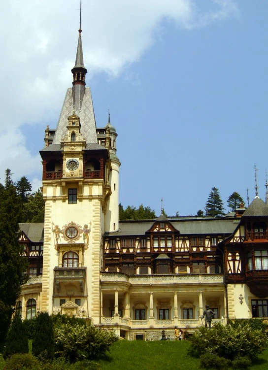 a tall, historic castle like building on a hill