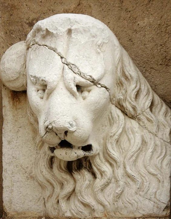 statue of a lion with a chain on its head