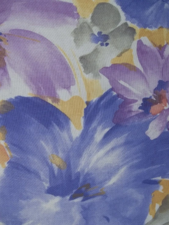 blue and purple flowers on fabric with white background