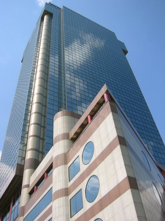tall glass building near a blue sky