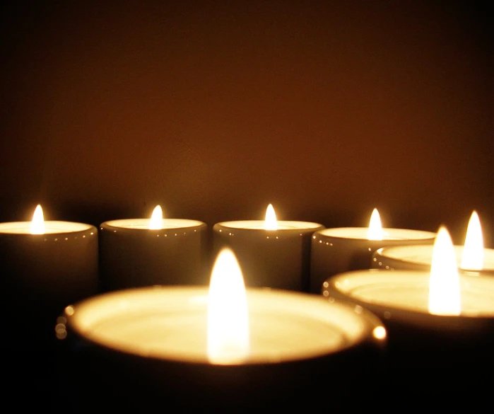 a row of candles are shown in this image