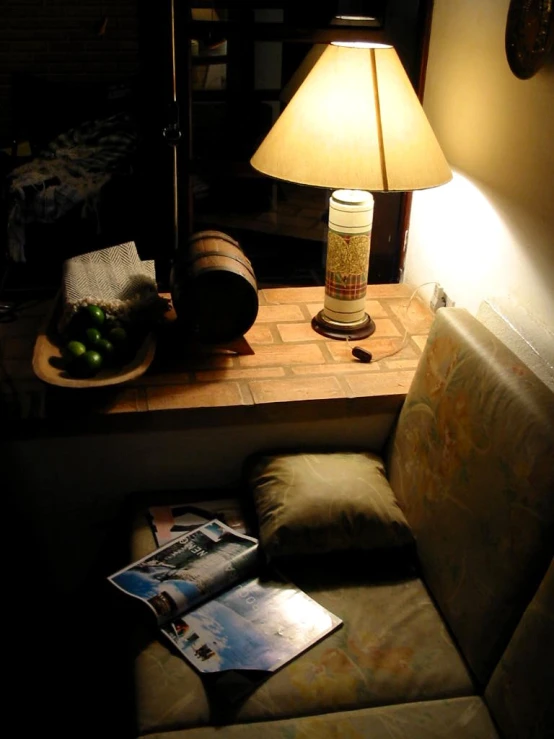 the lamp is on on the small side table beside the couch