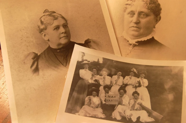 an old fashioned po of three women in dresses