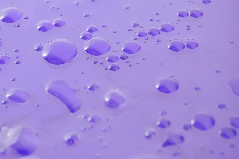 a background of water bubbles with purple color