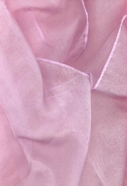 a closeup of an up close s of a pink sheer fabric