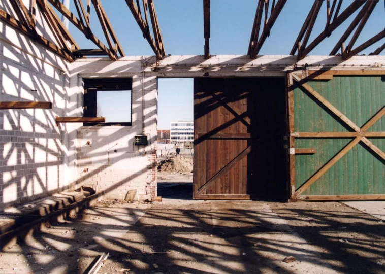 an open wooden door that leads into a building