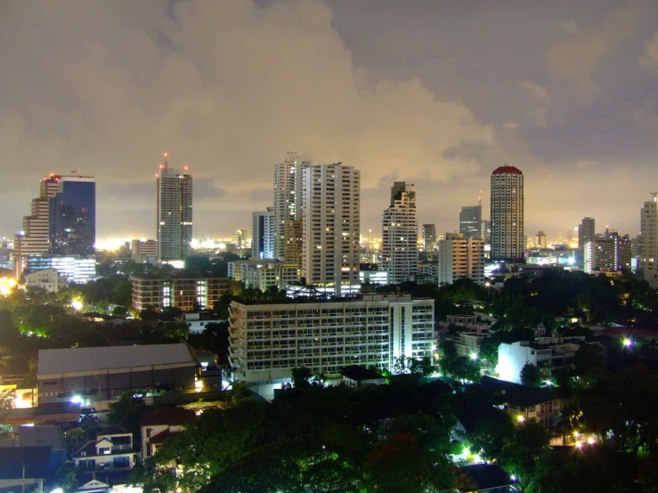 a large city skyline illuminated by the lights of the buildings