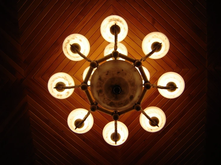 a chandelier in the middle of the ceiling, with nine lights hanging down