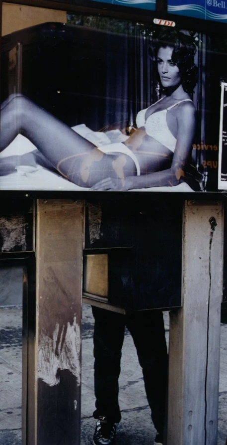 woman in bathing suit sitting on a metal pole