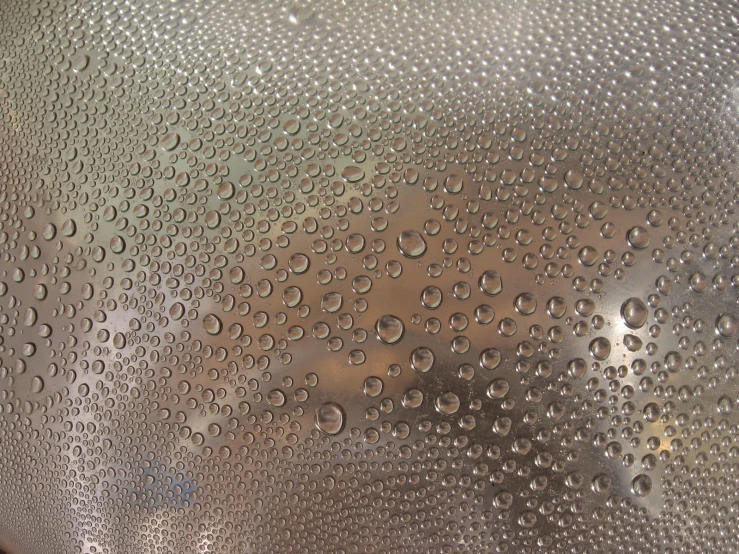 rain drops on the top of a glass window