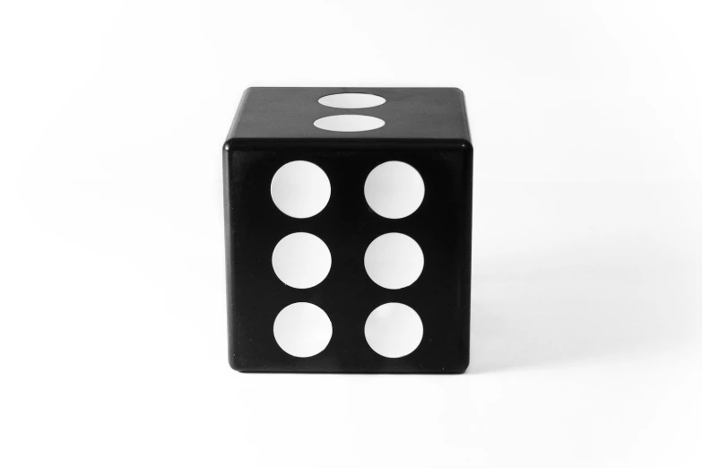 a dice with seven white spots is shown on the white background