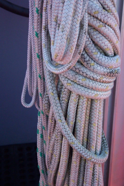 a large bundle of rope hanging off the side of a building