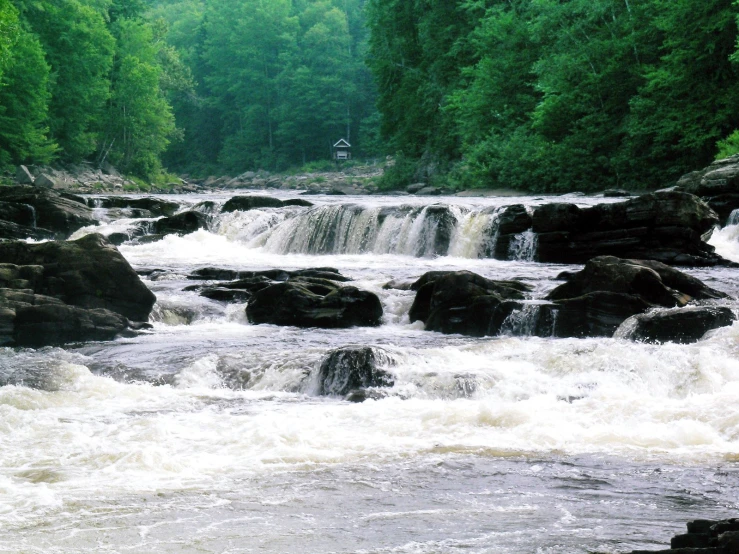 a river with a few rapids flowing through it