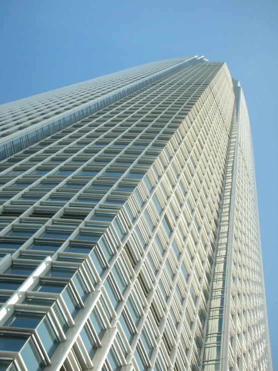 tall white building with many windows on it