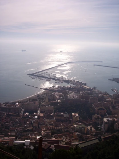 an aerial view of a city and the sea from a tall structure